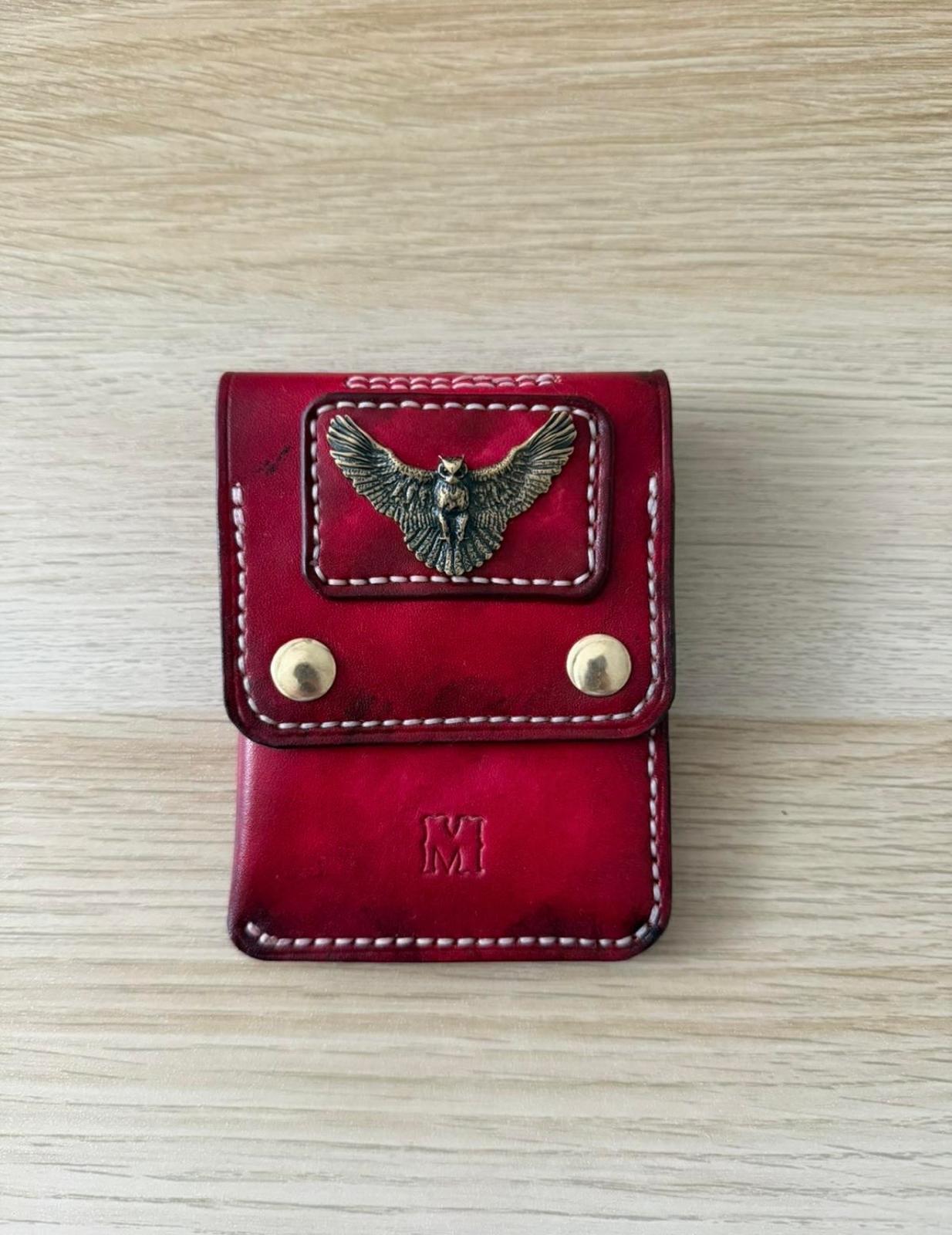 Oxblood card case with cast brass concho